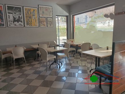Pizzeria takeaway and with indoor and outdoor tables
